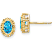 14K Yellow Gold Oval Blue Topaz Stud Earrings - 0.56 Carat Total Gemstone Weight by Monteluci Fine Jewelry