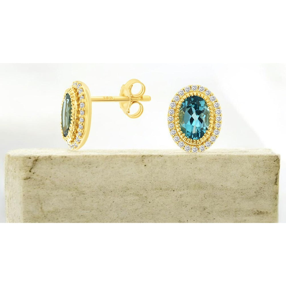 14K Yellow Gold Oval Blue Topaz Stud Earrings with Diamond Halo and Milgrain Detailing - 1.76 Carat Total Blue Topaz Weight and 0.19 Carat Total Diamond Weight - Royal Jewelry