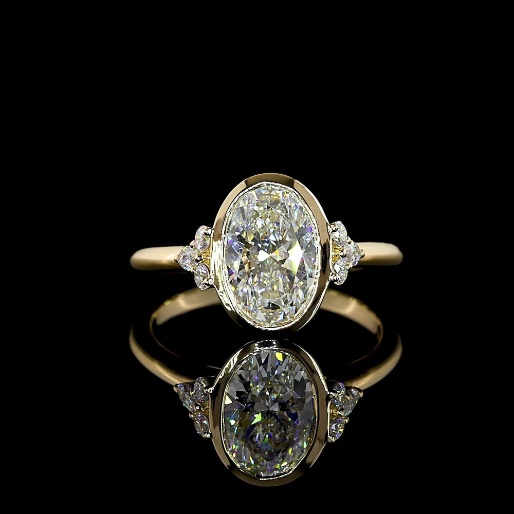 14K Yellow Gold Oval Cut Lab Diamond Ring with Bezel Setting and Marquise & Round Side Accents - 2.17 Carats Total Diamond Weight - Covaloro Fine Jewelry