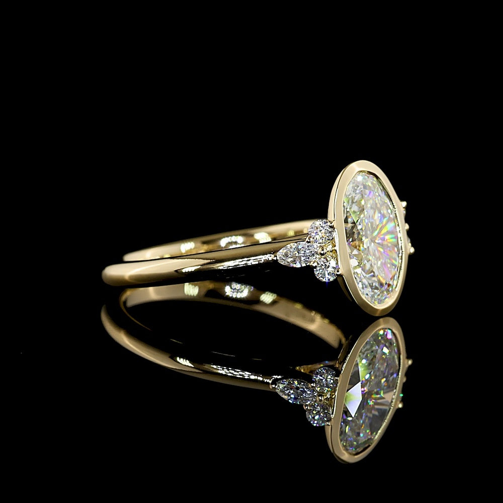 14K Yellow Gold Oval Cut Lab Diamond Ring with Bezel Setting and Marquise & Round Side Accents - 2.17 Carats Total Diamond Weight - Covaloro Fine Jewelry