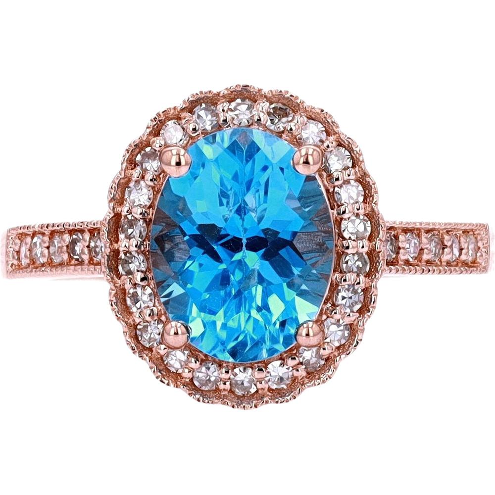 14K Yellow Gold Oval London Blue Topaz Halo Ring with 0.25 Carats Diamond Accents