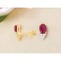 14K Yellow Gold Oval Ruby Stud Earrings with Diamond Triangle Accents - 2.12 Carat Total Ruby Weight and 0.19 Carat Total Diamond Weight - Royal Jewelry