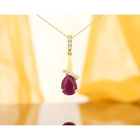 14K Yellow Gold Pear Ruby Pendant with Round Diamond Accents - 0.60 Carat Ruby and 0.05 Carat Total Diamond Weight - Royal Jewelry