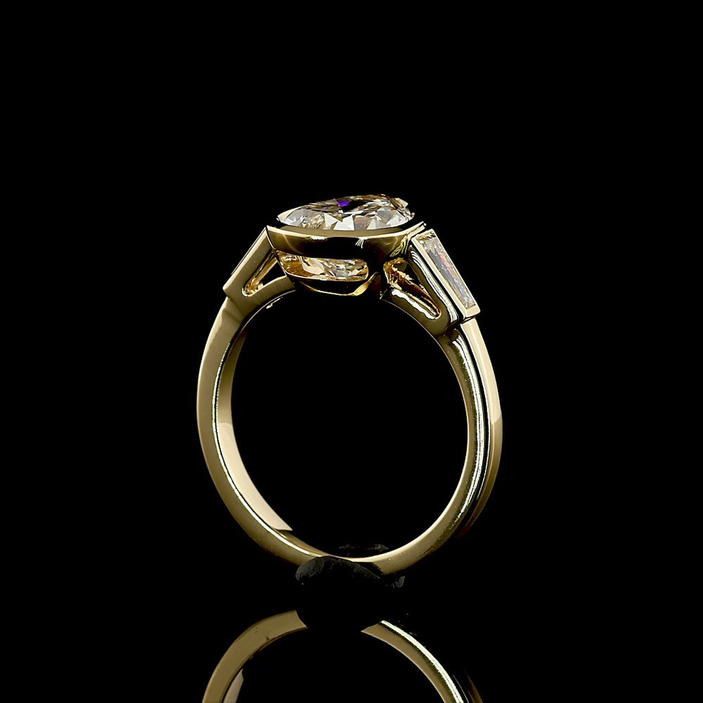 14K Yellow Gold Pear Shape Three Stone Ring with Bezel Set 2.52 Carat Lab Diamond and Tapered Baguette Side Stones - 2.93 Carat Total Diamond Weight - Covaloro Fine Jewelry