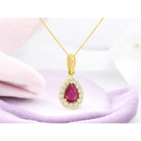 14K Yellow Gold Pear-Shaped Ruby and Diamond Halo Pendant Necklace - 0.50 Carat Ruby and 0.12 Carat Total Diamond Weight - Royal Jewelry