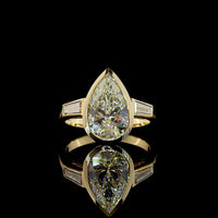 14K Yellow Gold Pear-Shaped Three-Stone Ring with Bezel-Set 3.50 Carat Lab Diamond and Tapered Baguettes - 4.00 Carat Total Weight - Covaloro Fine Jewelry