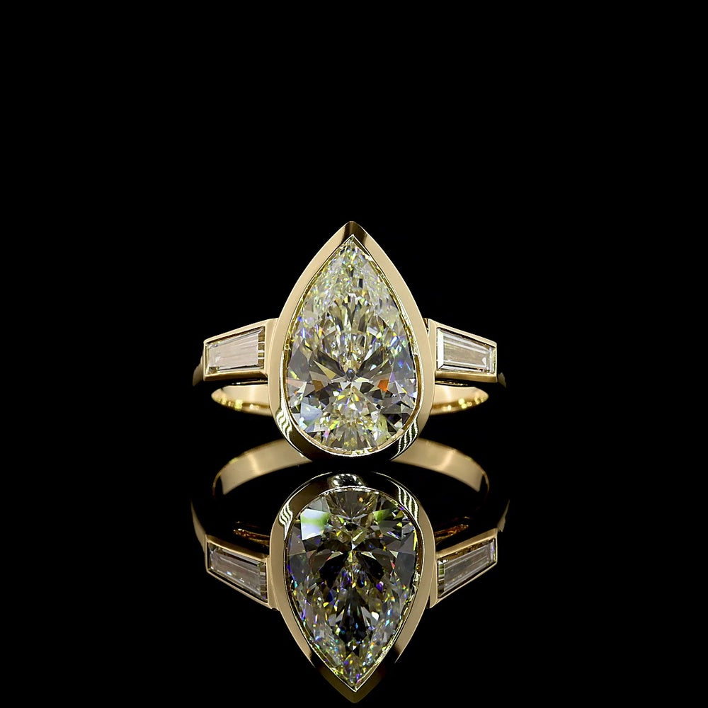 14K Yellow Gold Pear-Shaped Three-Stone Ring with Bezel-Set 3.50 Carat Lab Diamond and Tapered Baguettes - 4.00 Carat Total Weight - Covaloro Fine Jewelry