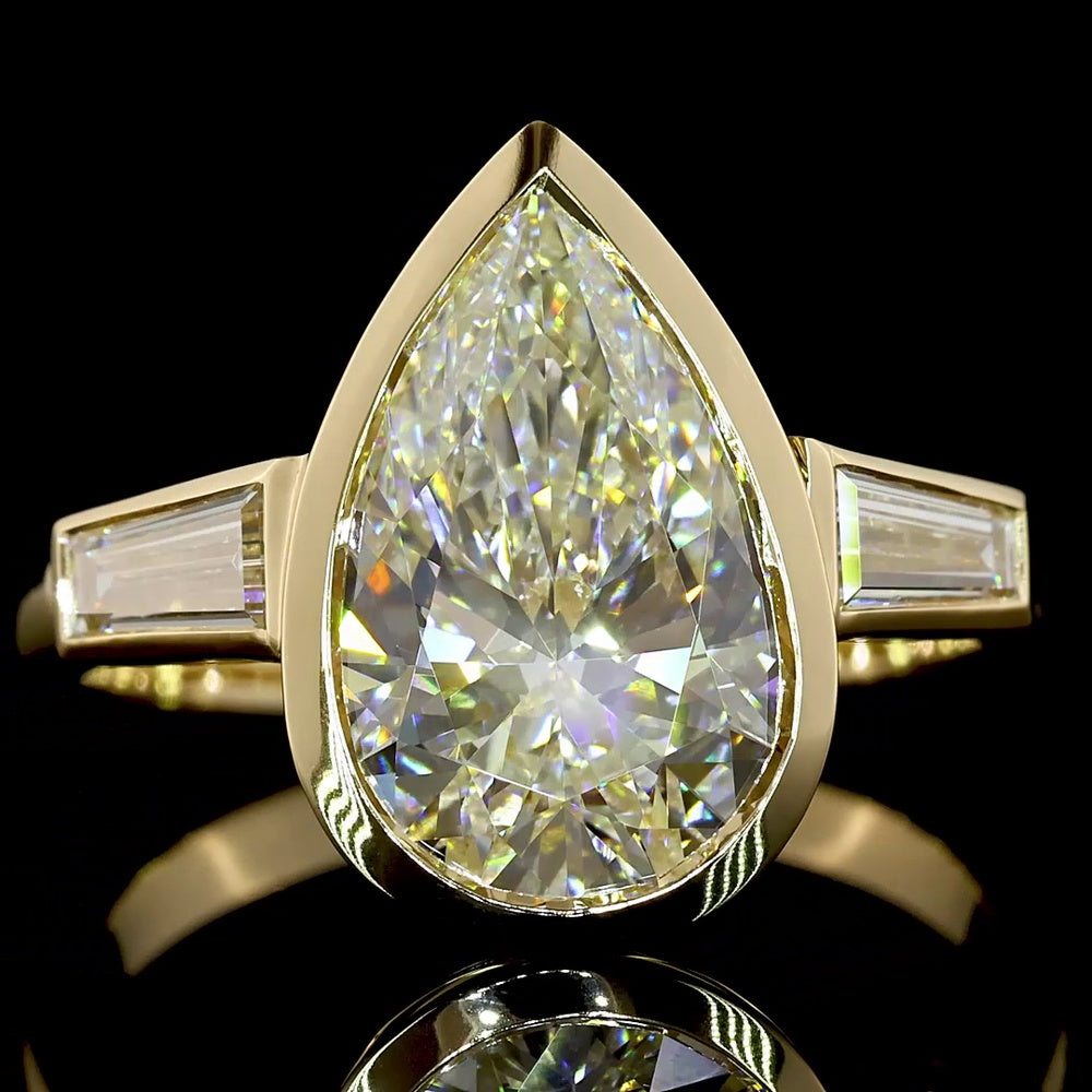 14K Yellow Gold Pear-Shaped Three-Stone Ring with Bezel-Set 3.50 Carat Lab Diamond and Tapered Baguettes - 4.00 Carat Total Weight - Covaloro Fine Jewelry