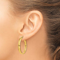 14K Yellow Gold Polished 25mm Hollow Hoop Earrings - Lightweight and Elegant Design by Monteluci Fine Jewelry
