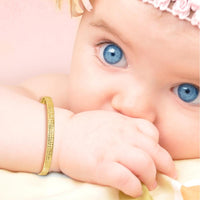 14K Yellow Gold Polished Diamond-Cut Flexible Baby Bangle by Oro Pregiato