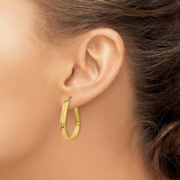 14K Yellow Gold Polished Oval Hoop Earrings - 24.6mm Length, 3.5mm Thickness by Oro Pregiato