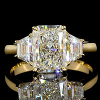 14K Yellow Gold Radiant Cut Three Stone Ring with 1.60 Carats D VVS2 Center Diamond and 0.63 Carats Trapezoid Side Stones - 2.23 Carats Total Diamond Weight - Covaloro Fine Jewelry