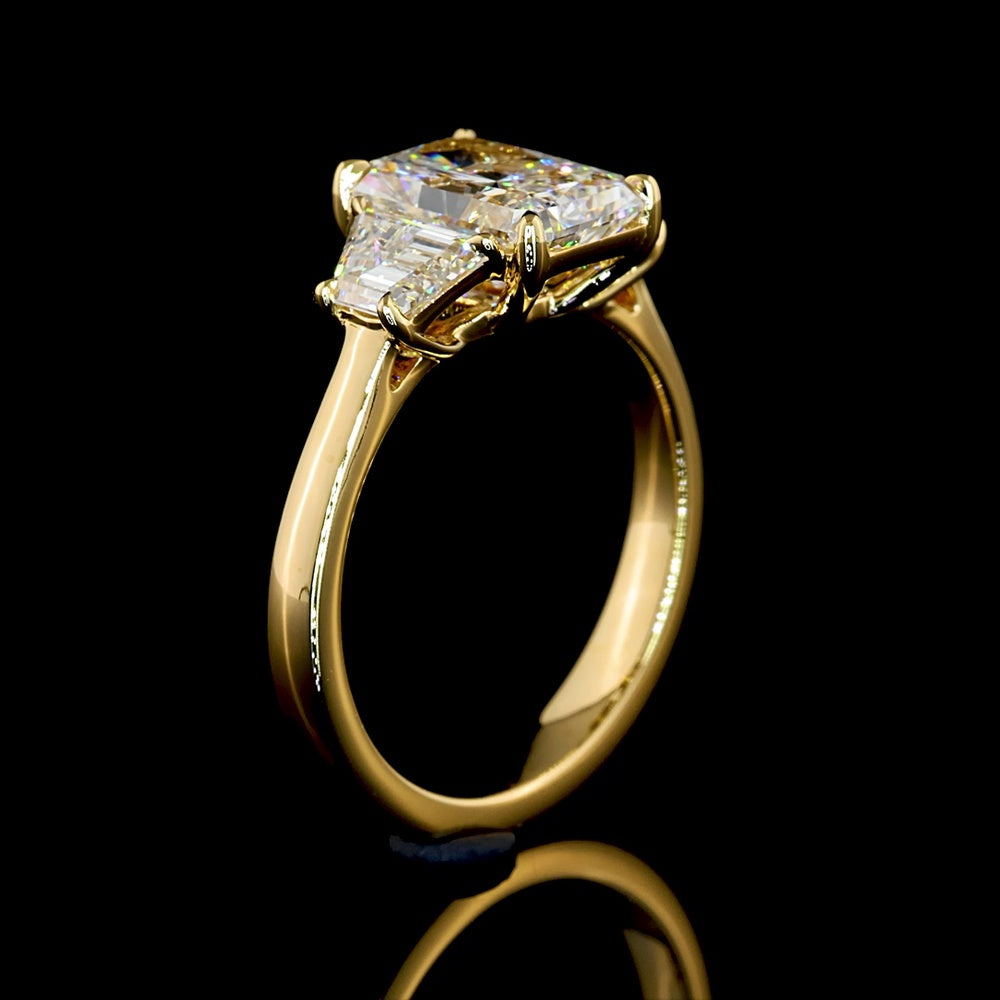 14K Yellow Gold Radiant Cut Three Stone Ring with 1.60 Carats D VVS2 Center Diamond and 0.63 Carats Trapezoid Side Stones - 2.23 Carats Total Diamond Weight - Covaloro Fine Jewelry