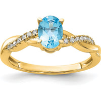 14K Yellow Gold Ring with 7x5mm Oval Blue Topaz and 0.084 Carat Total Round Diamond Accents by 0