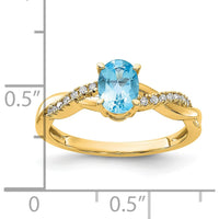 14K Yellow Gold Ring with 7x5mm Oval Blue Topaz and 0.084 Carat Total Round Diamond Accents by 0