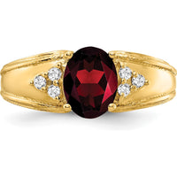 14K Yellow Gold Ring with 8x6mm Oval Garnet and 0.09 Carat Total Round Diamond Accents by Monteluci Fine Jewelry