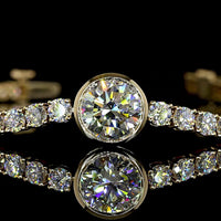 14K Yellow Gold Tennis Bracelet with 2.01 Carats Bezel Set Round Lab Diamond Center and 58 Prong Set Round Lab Diamonds - 7.99 Carats Total Diamond Weight - Covaloro Fine Jewelry