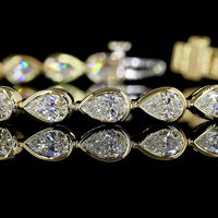 14K Yellow Gold Tennis Bracelet with East-West Bezel Set Pear Shape Lab Diamonds - 5.91 Carat Total Diamond Weight, E-F Color VS Clarity - Covaloro Fine Jewelry