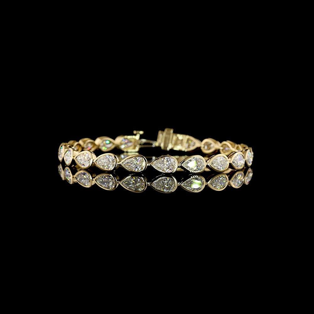 14K Yellow Gold Tennis Bracelet with East-West Bezel Set Pear Shaped Lab Diamonds - 10.98 Carat Total Weight (21 Stones, E-F Color, VS1 Clarity) - Covaloro Fine Jewelry