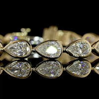 14K Yellow Gold Tennis Bracelet with East-West Bezel Set Pear Shaped Lab Diamonds - 10.98 Carat Total Weight (21 Stones, E-F Color, VS1 Clarity) - Covaloro Fine Jewelry