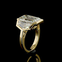 14K Yellow Gold Three-Stone Bezel Set Ring with Emerald Cut Lab Diamonds - 9.08 Carats Center, 12.22 Carats Total Diamond Weight - Covaloro Fine Jewelry