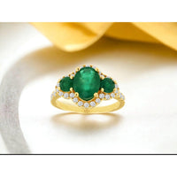 14K Yellow Gold Three-Stone Halo Ring with 2.30 Carat Oval Emerald and 0.60 Carat Round Emerald Accents Surrounded by Brilliant Diamonds - Royal Jewelry