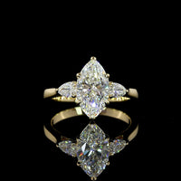 14K Yellow Gold Three-Stone Ring with 1.53 Carat Marquise Cut Lab Diamond and Pear Shape Side Stones - 1.8 Carat Total Diamond Weight - Covaloro Fine Jewelry