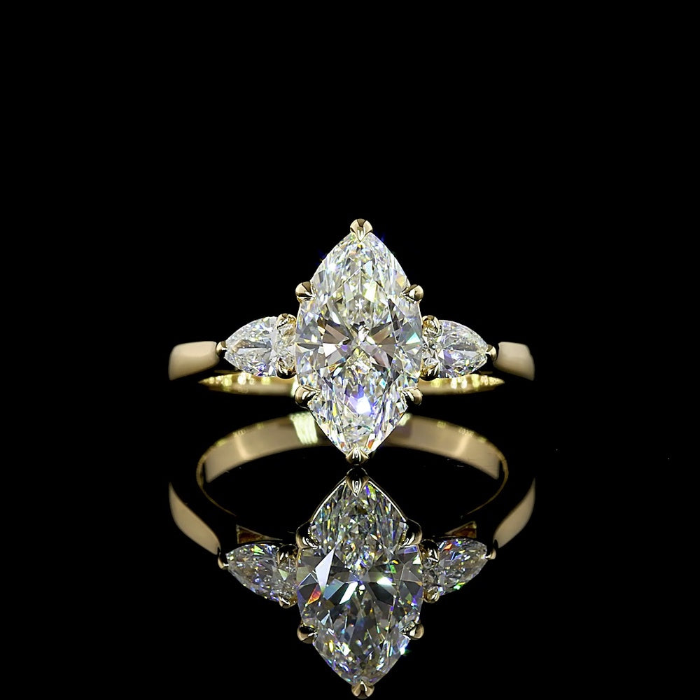 14K Yellow Gold Three-Stone Ring with 1.53 Carat Marquise Cut Lab Diamond and Pear Shape Side Stones - 1.8 Carat Total Diamond Weight - Covaloro Fine Jewelry
