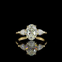 14K Yellow Gold Three Stone Ring with 1.56 Carat Oval Cut Lab Diamond (D VVS2) and 0.49 Carat Pear Shaped Lab Diamonds - 2.05 Carat Total Diamond Weight - Covaloro Fine Jewelry