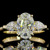 14K Yellow Gold Three Stone Ring with 1.56 Carat Oval Cut Lab Diamond (D VVS2) and 0.49 Carat Pear Shaped Lab Diamonds - 2.05 Carat Total Diamond Weight - Covaloro Fine Jewelry