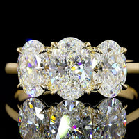 14K Yellow Gold Three Stone Ring with 2.05 Carats Oval Cut Lab Diamond and 0.94 Carats Half-Moon Lab Diamonds - 2.99 Carats Total Diamond Weight - Covaloro Fine Jewelry