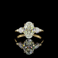 14K Yellow Gold Three Stone Ring with 2.20 Carat Oval Cut Lab Diamond and 0.60 Carat Pear Cut Lab Diamonds - 2.80 Carat Total Weight - Covaloro Fine Jewelry