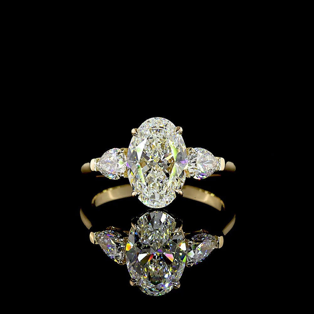 14K Yellow Gold Three Stone Ring with 2.20 Carat Oval Cut Lab Diamond and 0.60 Carat Pear Cut Lab Diamonds - 2.80 Carat Total Weight - Covaloro Fine Jewelry