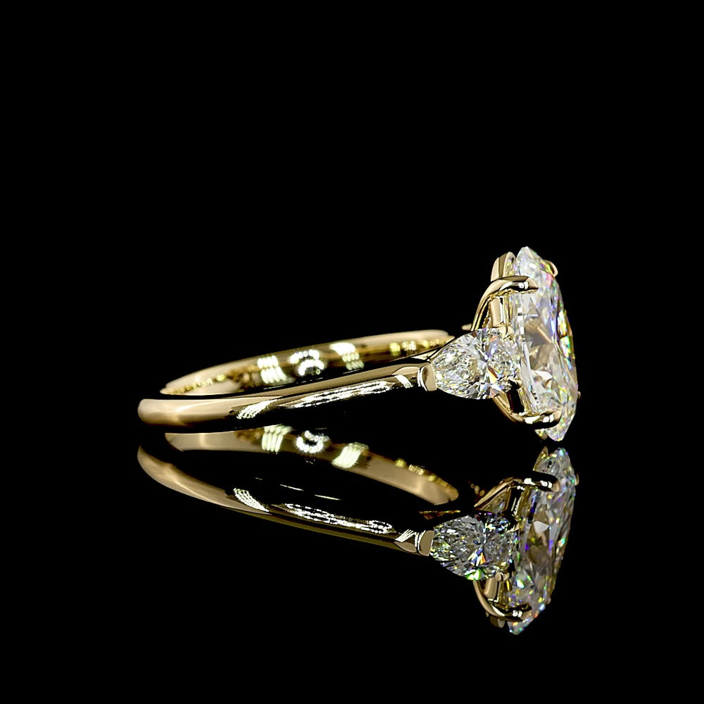 14K Yellow Gold Three Stone Ring with 2.20 Carat Oval Cut Lab Diamond and 0.60 Carat Pear Cut Lab Diamonds - 2.80 Carat Total Weight - Covaloro Fine Jewelry