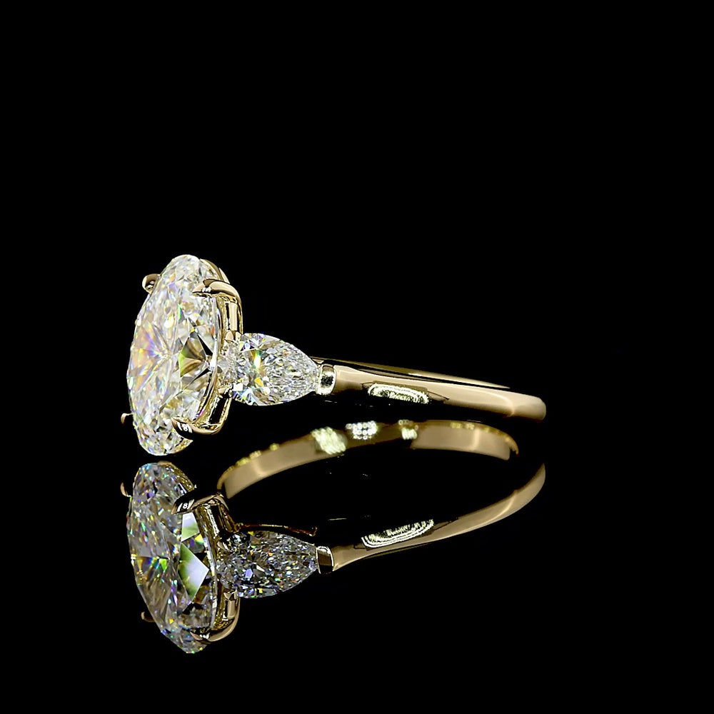 14K Yellow Gold Three Stone Ring with 2.20 Carat Oval Cut Lab Diamond and 0.60 Carat Pear Cut Lab Diamonds - 2.80 Carat Total Weight - Covaloro Fine Jewelry