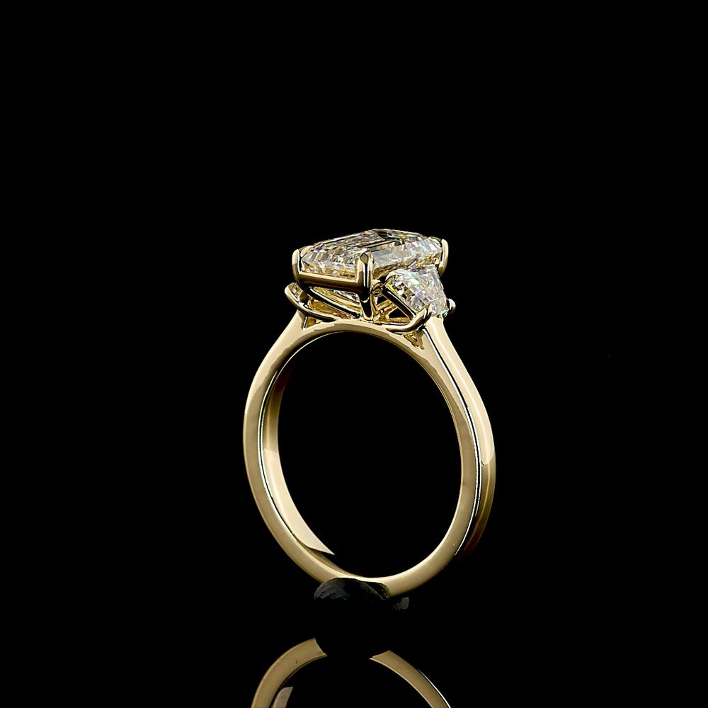 14K Yellow Gold Three-Stone Ring with 2.23 Carat Emerald Cut Lab Diamond and 0.72 Carat Trapezoid Side Diamonds - Total 2.95 Carats - Covaloro Fine Jewelry