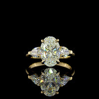 14K Yellow Gold Three Stone Ring with 2.57 Carat Oval Cut Lab Diamond and Pear Shape Side Stones - 3.23 Carat Total Diamond Weight - Covaloro Fine Jewelry