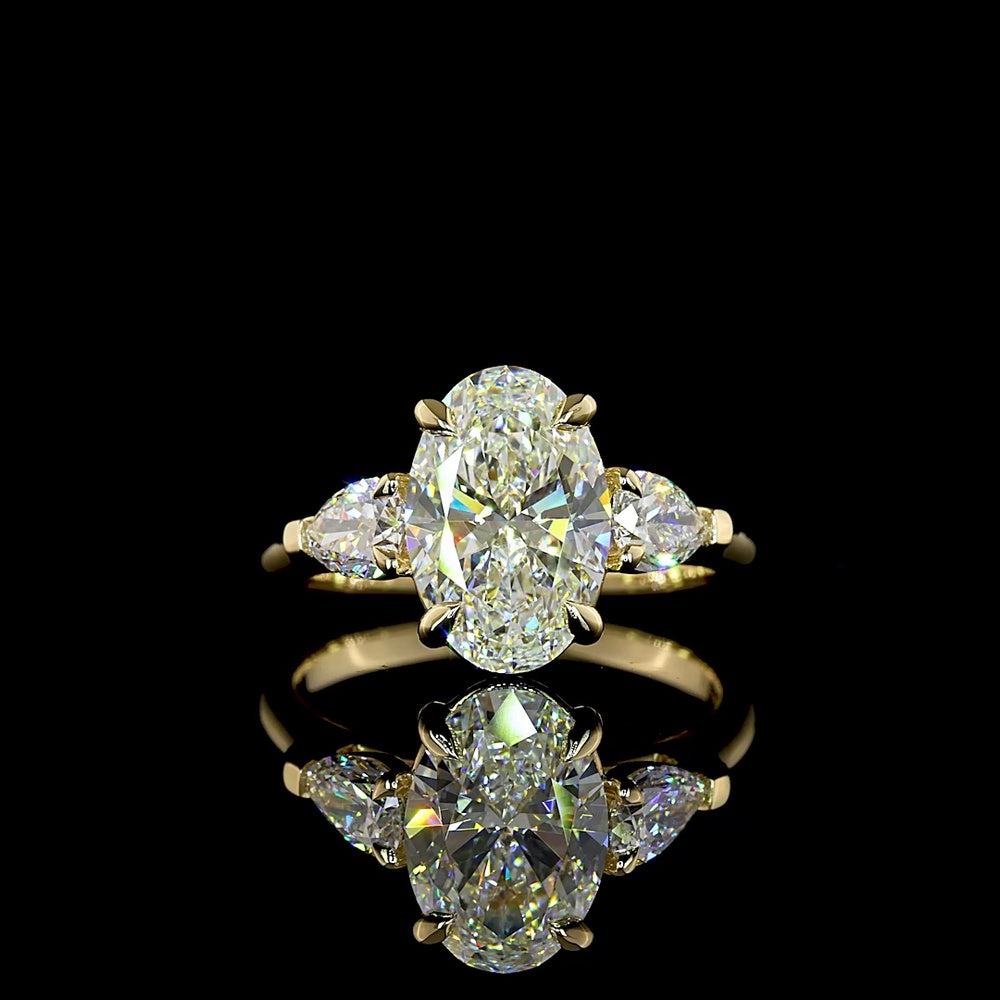 14K Yellow Gold Three Stone Ring with 2.57 Carat Oval Cut Lab Diamond and Pear Shape Side Stones - 3.23 Carat Total Diamond Weight - Covaloro Fine Jewelry