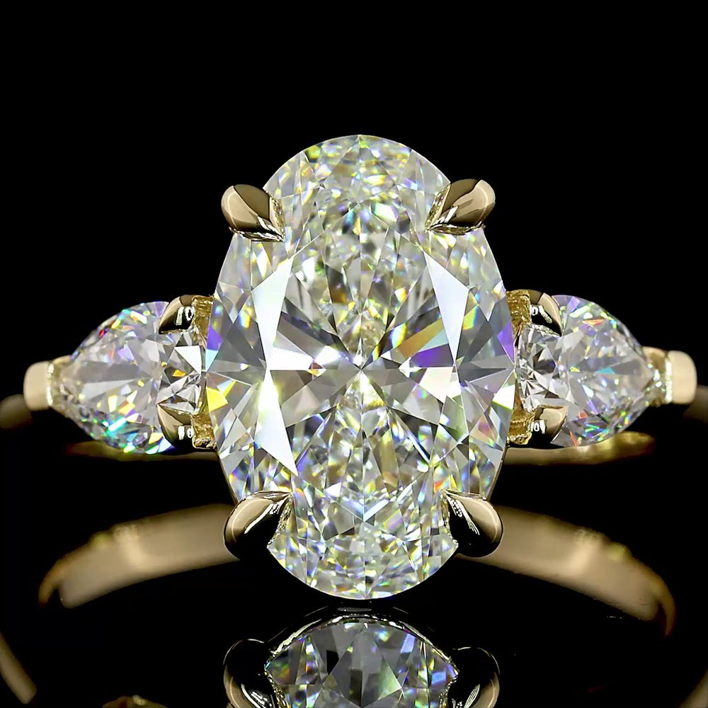 14K Yellow Gold Three Stone Ring with 2.57 Carat Oval Cut Lab Diamond and Pear Shape Side Stones - 3.23 Carat Total Diamond Weight - Covaloro Fine Jewelry