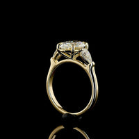 14K Yellow Gold Three Stone Ring with 2.57 Carat Oval Cut Lab Diamond and Pear Shape Side Stones - 3.23 Carat Total Diamond Weight - Covaloro Fine Jewelry