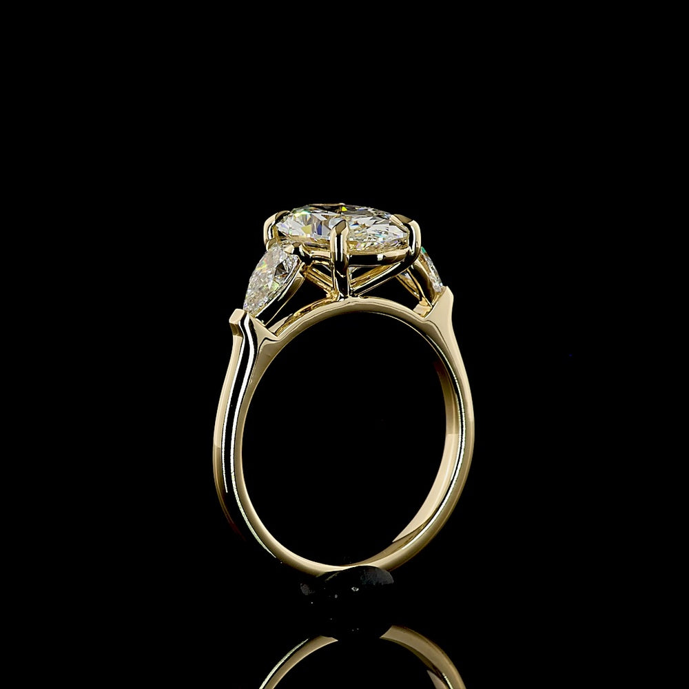 14K Yellow Gold Three Stone Ring with 2.57 Carat Oval Cut Lab Diamond and Pear Shape Side Stones - 3.23 Carat Total Diamond Weight - Covaloro Fine Jewelry