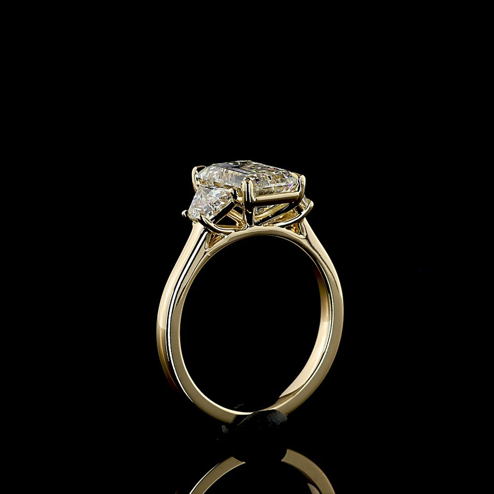 14K Yellow Gold Three Stone Ring with 2.69 Carat Emerald Cut Lab Diamond and 0.79 Carat Trapezoid Side Stones - 3.48 Carat Total Diamond Weight - Covaloro Fine Jewelry