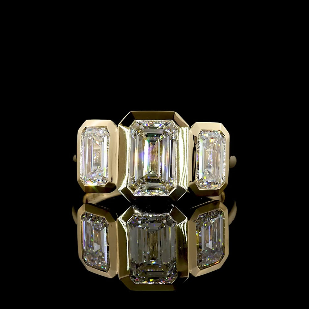 14K Yellow Gold Three-Stone Ring with 4.02 Carat Total Weight Emerald Cut CVD Lab Diamonds in Bezel Settings - Covaloro Fine Jewelry