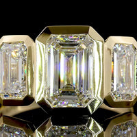 14K Yellow Gold Three-Stone Ring with 4.02 Carat Total Weight Emerald Cut CVD Lab Diamonds in Bezel Settings - Covaloro Fine Jewelry