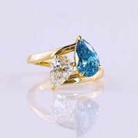 14K Yellow Gold Toi et Moi Ring with 1.50 Carat Pear Shape Fancy Blue Lab Diamond and 1.00 Carat Pear Shape Colorless Lab Diamond - 2.50 Carat Total Weight - Covaloro Fine Jewelry
