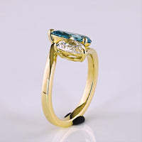 14K Yellow Gold Toi et Moi Ring with 1.50 Carat Pear Shape Fancy Blue Lab Diamond and 1.00 Carat Pear Shape Colorless Lab Diamond - 2.50 Carat Total Weight - Covaloro Fine Jewelry