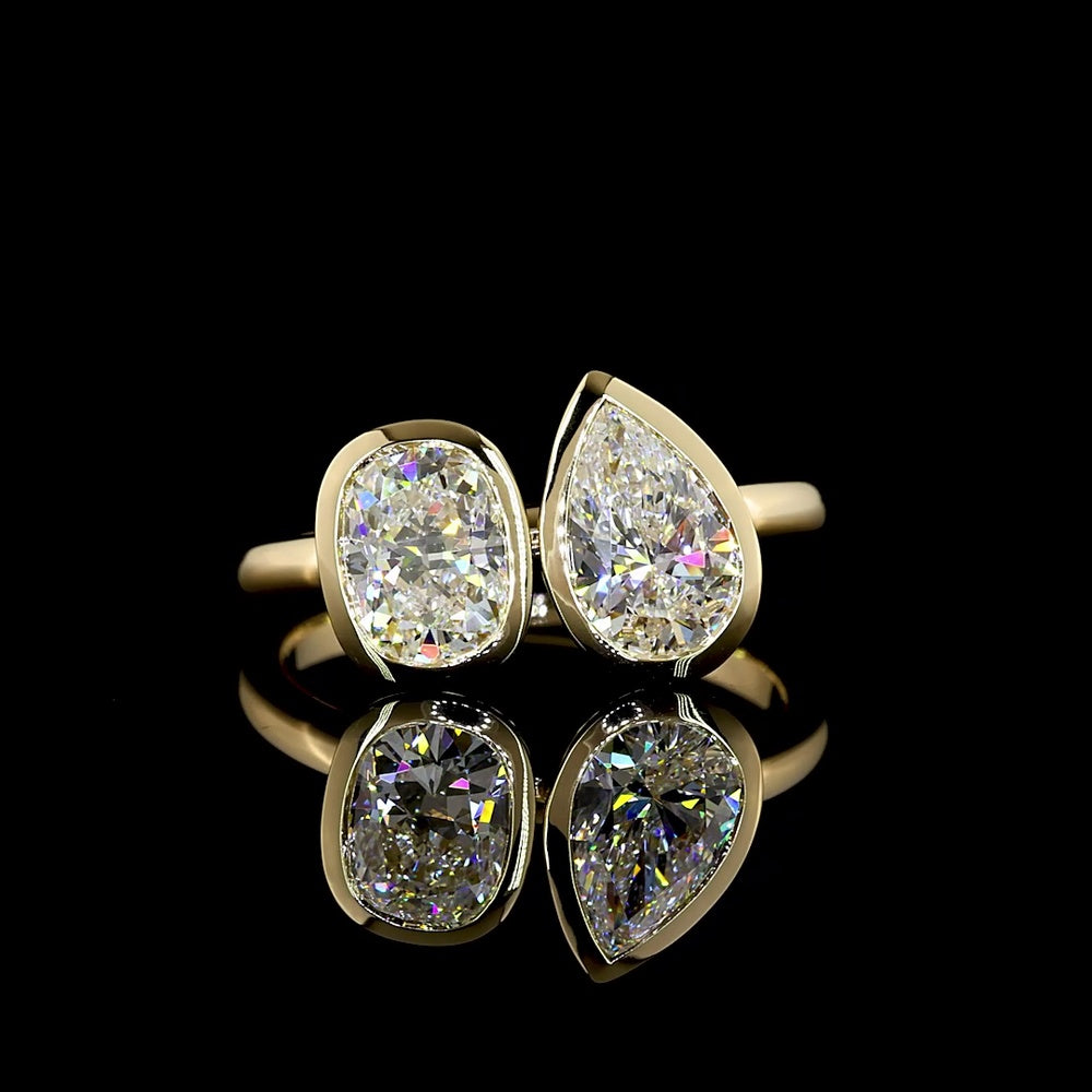 14K Yellow Gold Toi et Moi Ring with 2.03 Carats Lab Grown Pear and Cushion Cut Diamonds in Bezel Setting - E VS1 Clarity - Covaloro Fine Jewelry