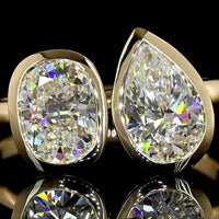 14K Yellow Gold Toi et Moi Ring with 2.03 Carats Lab Grown Pear and Cushion Cut Diamonds in Bezel Setting - E VS1 Clarity - Covaloro Fine Jewelry