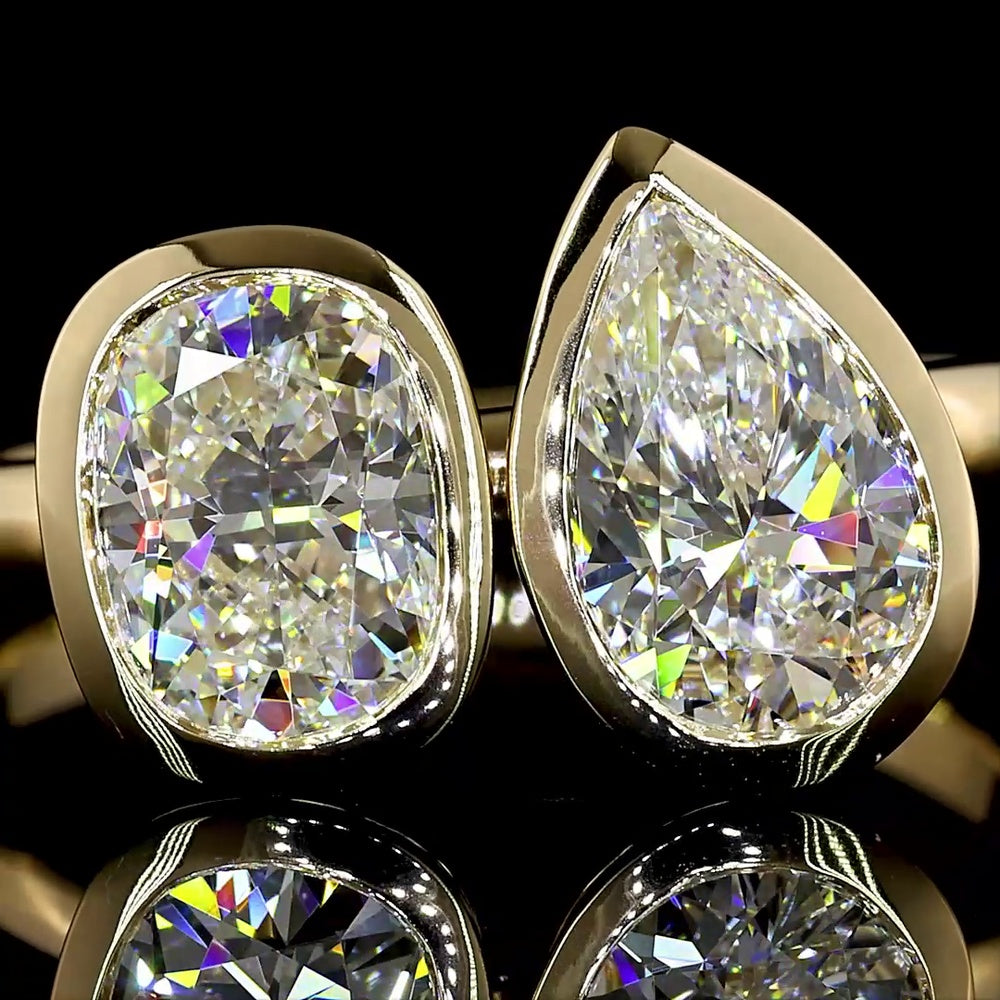 14K Yellow Gold Toi et Moi Ring with 2.03 Carats Lab Grown Pear and Cushion Cut Diamonds in Bezel Setting - E VS1 Clarity - Covaloro Fine Jewelry