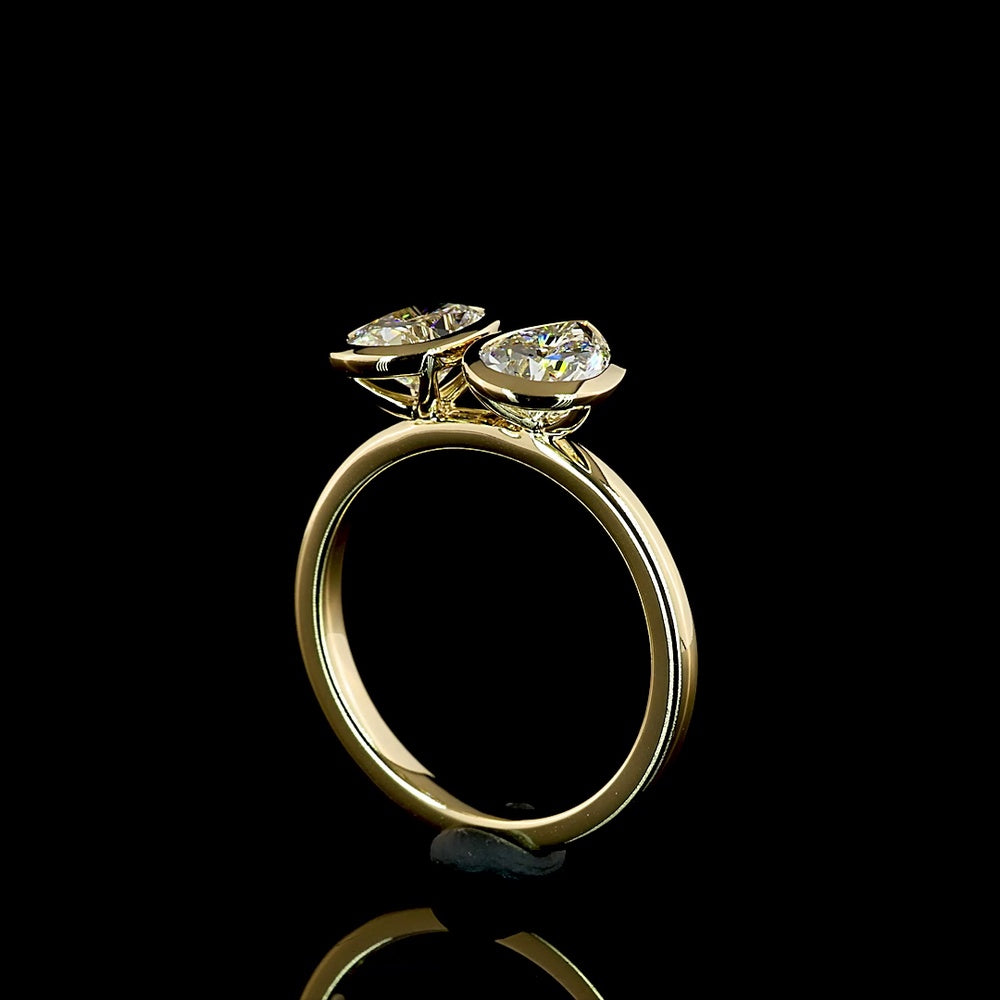 14K Yellow Gold Toi et Moi Ring with 2.03 Carats Lab Grown Pear and Cushion Cut Diamonds in Bezel Setting - E VS1 Clarity - Covaloro Fine Jewelry